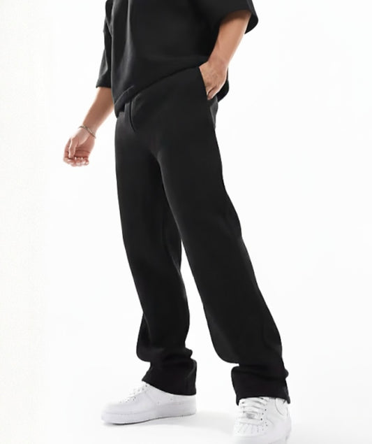 Black Terry Cotton Sweatpants. Featuring a modern straight-leg fit, three functional pockets, and ultra-soft fabric. Your new wardrobe staple.