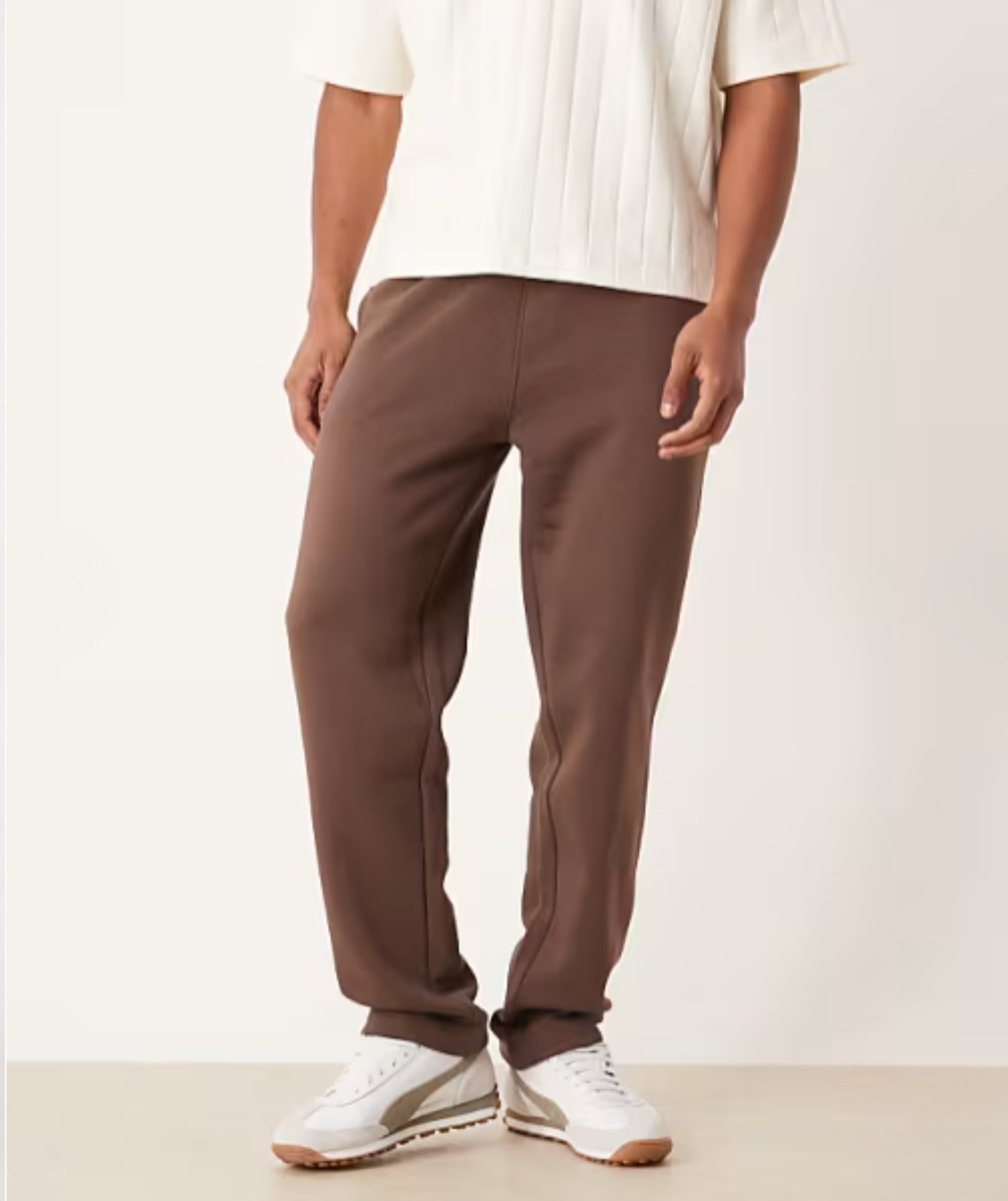 Brown Terry Cotton Sweatpants. Featuring a stylish straight-leg fit, three pockets, and premium soft fabric. Shop the perfect modern neutral.