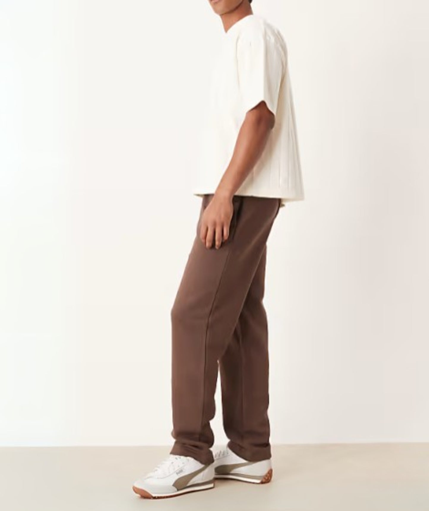 Brown Terry Cotton Sweatpants. Featuring a stylish straight-leg fit, three pockets, and premium soft fabric. Shop the perfect modern neutral.