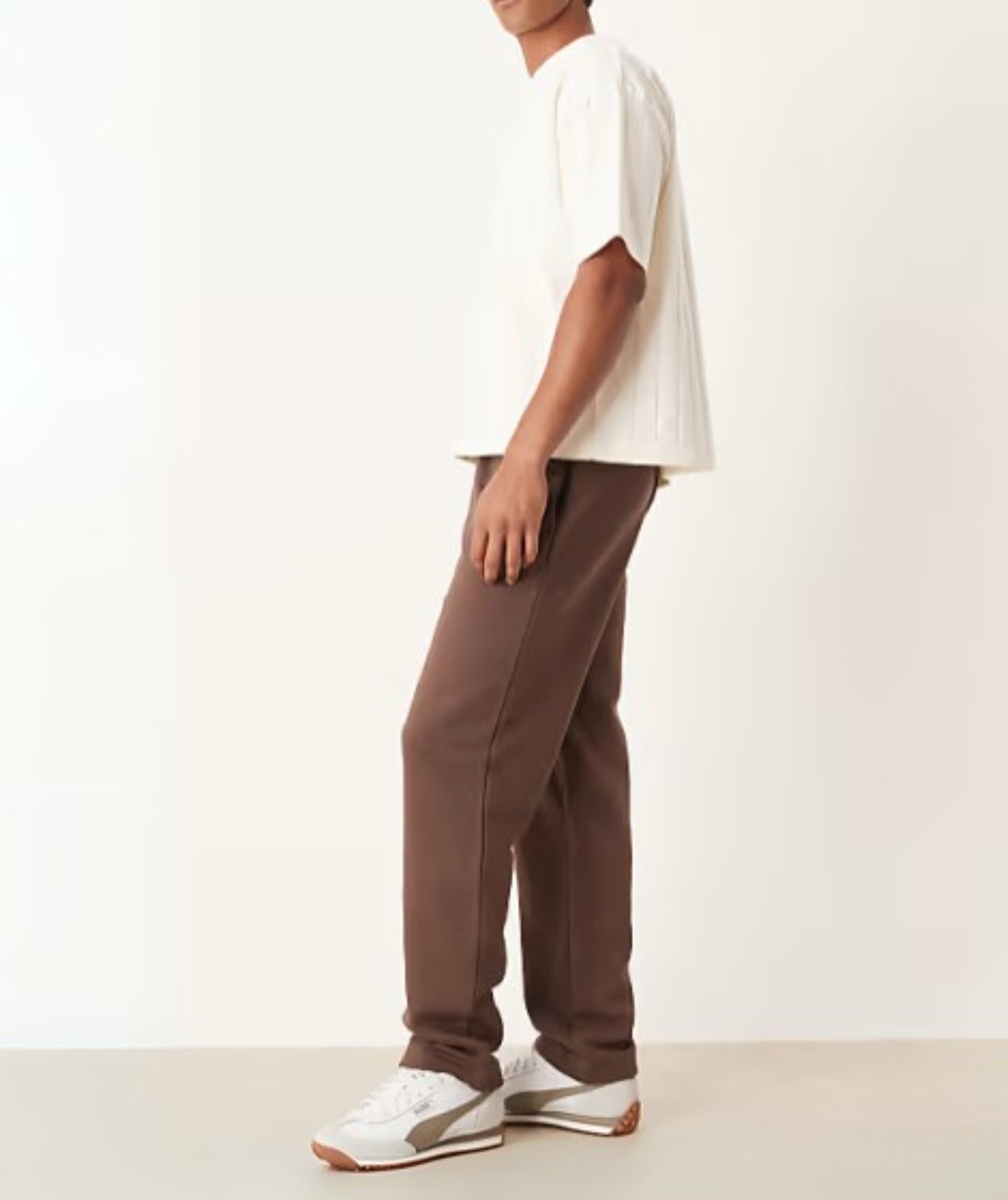 Brown Terry Cotton Sweatpants. Featuring a stylish straight-leg fit, three pockets, and premium soft fabric. Shop the perfect modern neutral.