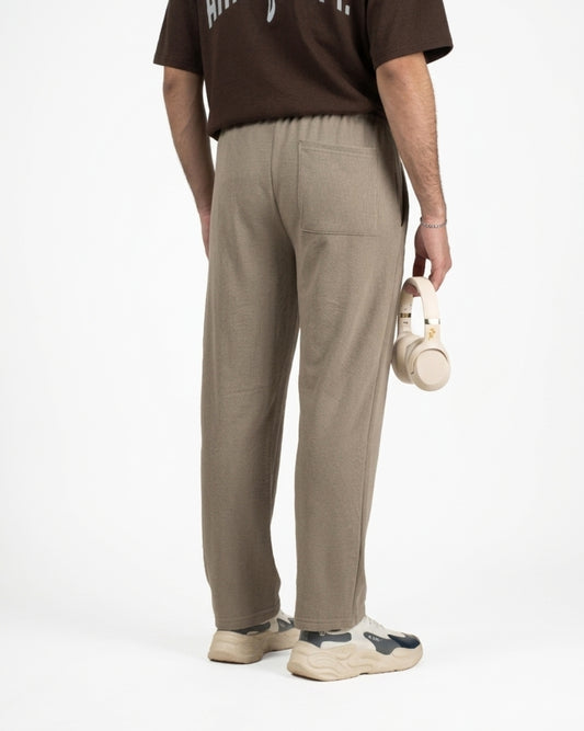 Person wearing beige straight sweatpants