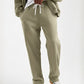 Light Olive Terry Cotton Sweatpants. Designed with a modern straight-leg fit, three pockets, and ultra-soft fabric. The perfect unique neutral.