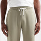 Light Olive Terry Cotton Sweatpants. Designed with a modern straight-leg fit, three pockets, and ultra-soft fabric. The perfect unique neutral.